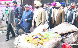 Mayor Bakshi Ram Arora, along with MC Commissioner Bhupinder Singh and employees, supervises the special cleanliness drive near Golden Temple in Amritsar on Thursday. 