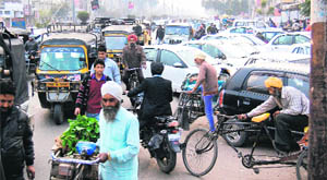 Heavy traffic flow and constant rule violation leads to massive jams at Gawal Mandi Chowk in Amritsar.