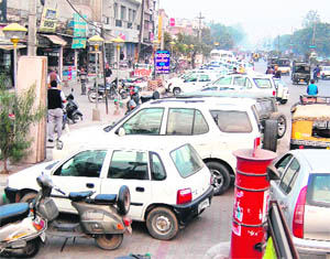 Illegal parking of vehicles on roads lead to chaos.