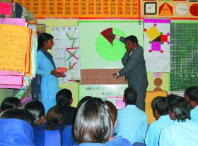 Maths teacher Sukhdev Mittal teaches students at the math lab in the Government Senior Secondary School, Deon. 