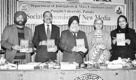 Raj Chengappa (second from left), Editor-in-Chief, The Tribune Group, releases a book on media ethics during a seminar at Punjabi University in Patiala on Thursday. Also present (left to right): Dr Navjit Singh Johal, head of the mass communication department, Punjabi University; Dr Jaspal Singh, Vice-Chancellor, Punjabi University; Dr Rajesh Gill, head of the sociology department, Panjab University, Chandigarh; and Dr Kirandeep Kaur, dean, education, Punjabi University.