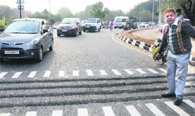 Rajesh Gupta, a BJP councillor, protests against construction of rumble strips as these slow down traffic leading to frequent jams.