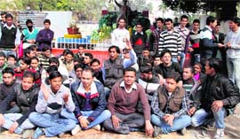 ABVP members stage a dharna at DAV (PG) College in Dehradun on Thursday.