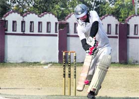 A player in action during the 61st Dehradun District Cricket League in Dehradun on Thursday.