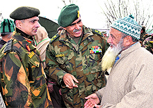 General Officer Commanding of Srinagar-based 15 Corps Lt Gen Om Prakash interacts with villagers at Shopian on Thursday