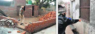 A policeman inspects the disputed plot following the firing incident; and (right) a member of the victims family shows a bullet mark at Bulara village near the Gill road on Thursday.