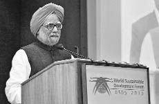 Prime Minister Manmohan Singh speaks at a summit in New Delhi on Thursday. 