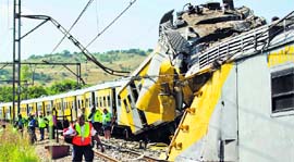Rescuers work on the site of a train accident near Kalefong station, Attridgeville, in the west of Pretoria on Thursday.