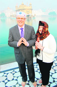 Premier of a Canadian province, Manitoba, Greg Slinger and his wife Claudette Toupin pay obeisance at the Golden Temple in Amritsar on Friday.