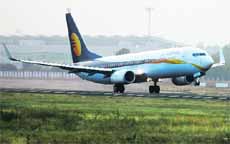 A Jet Airways passenger plane takes off from Ahmedabad airport. India's No. 2 carrier is close to a tieup with Abu Dhabi's Etihad Airways. 