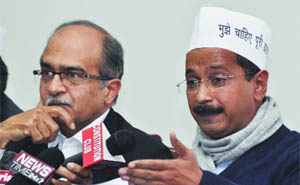 Aam Aadmi Party leader Arvind Kejriwal, along with Prashant Bhushan, addresses a press conference in New Delhi on Friday. 