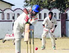 A player in action during the 61st Dehradun District Cricket League in Dehradun on Friday.