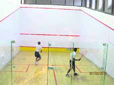 Players in action during the RIMC squash tournament in Dehradun on Friday. 