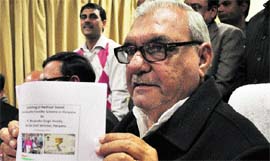 Chief Minister Bhupinder Singh Hooda launches in Delhi the Aadhaar-based direct benefits transfer scheme in Haryana on Friday.