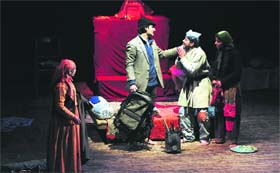 Artistes enact a scene from the play Sabse Bada Rupaiya at the Gaiety Theatre in Shimla on Friday.