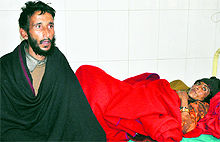 Mohd Mushtaq and Sharifa Begum of Naryian in Nowshera, parents of the missing baby, at the Shri Maharaja Gulab Singh Hospital in Jammu on Friday