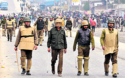 Security forces try to control protesters during the JDA anti-encroachment drive in Jammu on Friday
