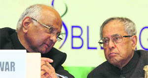 President Pranab Mukherjee with Union Agriculture Minister Sharad Pawar in New Delhi on Friday. 