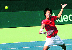South Koreas Cho Min Hyeok volleys to Indias Virali-Murugesan Ranjeet during the first singles match