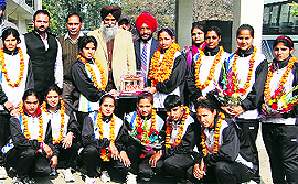 The Punjabi University girls pose with the trophy in Patiala