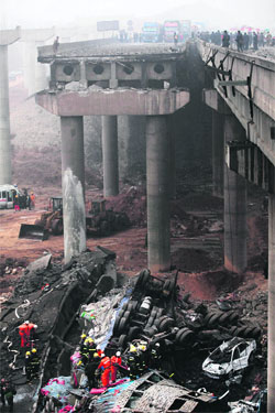 The collapsed Yichang bridge in Henan province, China, on Friday. 