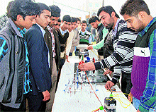 Students exhibit a science model during a technology festival at the Universal Group of Institutions in Lalru