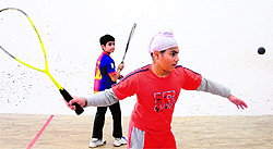 A player returns a shot during the State Squash Championship at Lake Sports Complex in Chandigarh on Saturday