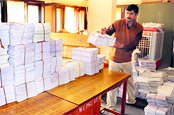 An employee organises bundles of voter lists at the MC office in Sector 4, Panchkula, on Saturday