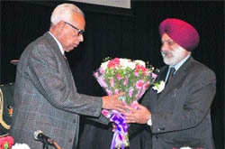 Prof MPS Ishar, Vice-Chancellor of the University of Jammu, greets Governor NN Vohra at a symposium in Jammu on Saturday. 