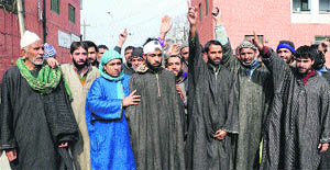 Residents of Raiyar protest against the village sarpanch in Srinagar on Saturday.