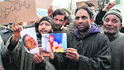 Residents of Ichgam village in Budgam district protest against a woman being set afire by her in-laws, in Srinagar on Saturday. Tribune photo: Amin War