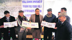 Officials release special cover of a stamp in Srinagar on Saturday. A tribune photograph
