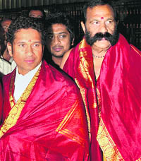 Sachin Tendulkar with Bapiraju, the chairman of the Tirumala Tirupati Devasthanam Trust, on Saturday morning.  PTI