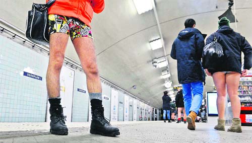 Participants take part in the annual No Pants Subway Ride in Stockholm. The event, organised by performance art group Improv Everywhere, involves participants who strip down to their underwear as they go about their normal routine.