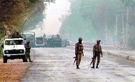 Pakistani troops patrol near the military checkpost in the Serai Norang area of Lakki Marwat district on Saturday.