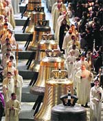 People attend a ceremony to inaugurate nine new church bells at Notre-Dame de Paris Cathedral in Paris on Saturday.
