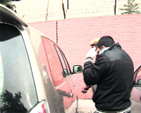 Pinjore firing accused Vikram being brought to court in his relative's car in Panchkula on Sunday. 