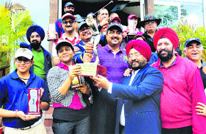 The winner golphers in jubiliant mood during the prize giving function of Rotary District Golf Tournament, Chandigarh on Sunday. 