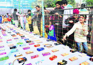 Students and parents attend the annual fete of Saupins School in Sector 32, Chandigarh, on Sunday. 