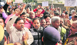 Members of the Uttaranchal Sanyukt Sarv Samaj Sangathan take out a march to the Chief Ministers residence in Dehradun on Sunday.