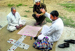 Men play Chopar a game of dice at Sundana village in Rohtak on Sunday