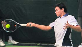 Indias Vikramjeet Singh Malik plays a forehand against Koreas Cho Min-Hyeok during the Davis Cup tie in New Delhi on Sunday.