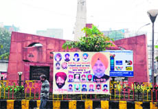 Hoardings welcoming newly elected DSGMC members erected in Amritsar on Monday. 
