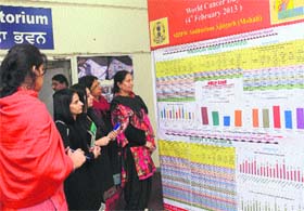 Women see the results of door-to-door survey by Punjab health officials to detect cancer patents at the Punjab State Health System Corporation office, Phase 6, Mohali, on Monday