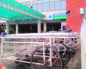 Stretchers and wheelchairs lying in the open at the Emergency and Advanced Trauma Centre in the PGI, Chandigarh