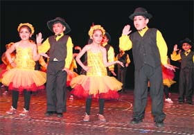 Students of Manav Mangal Smart School present an item during a cultural function in Mohali