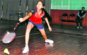 Girls winner Rishikha Tomar plays a shot during the final match of the District Badminton Championhip U-16 event at the City Sports Complex in Haridwar on Monday.