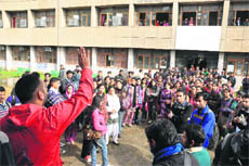 Students protest against fee hike on Jammu University campus in Jammu on Monday.