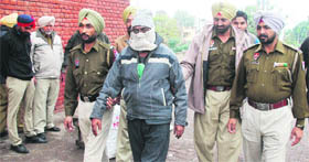 The accused chemist in police custody in Ludhiana on Monday.