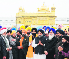 Deputy CM Sukhbir Badal, SGPC chief AS Makkar and DSGMC members at the Golden Temple on Monday.